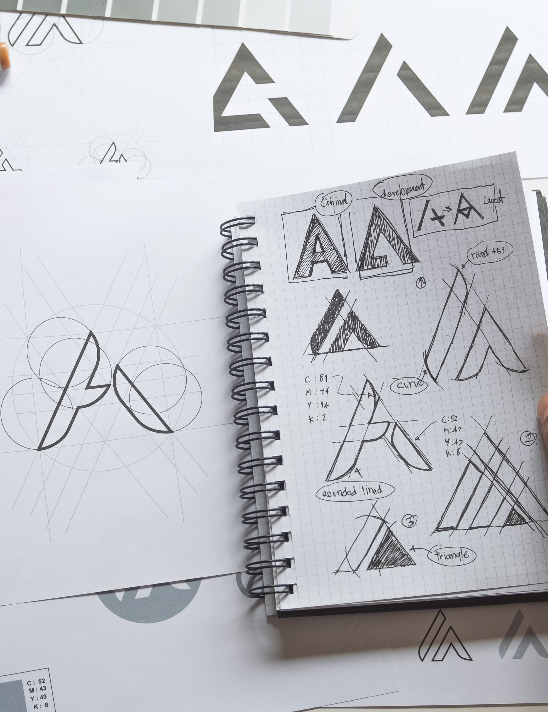 Logo construction sketches and geometric grids
